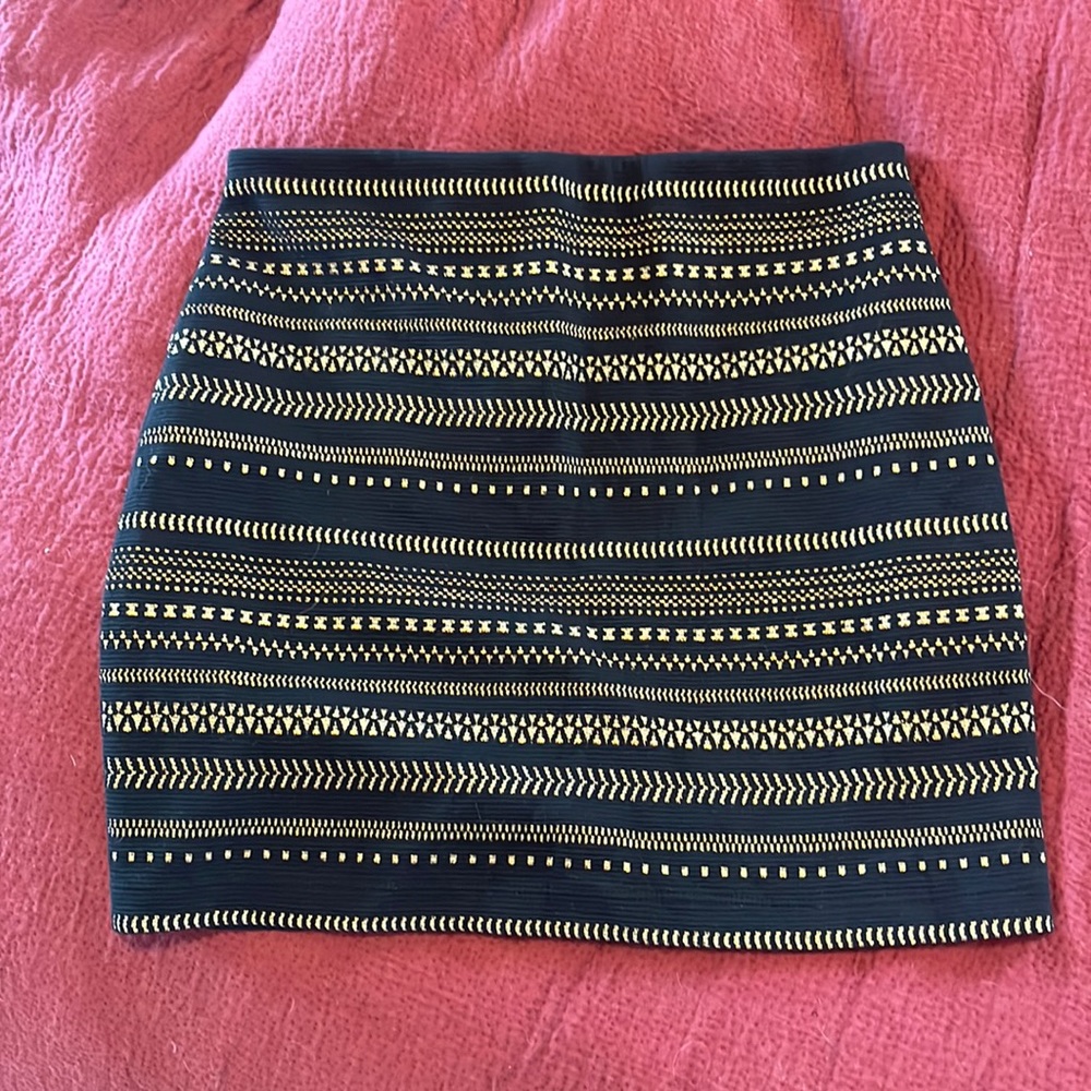 Express size small mini skirt black and gold. Never worn.